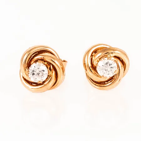 Örhängen knutar i 18K guld med vita stenar. Ø 7 mm. Vikt 0,9g Vikt: 0,9 g