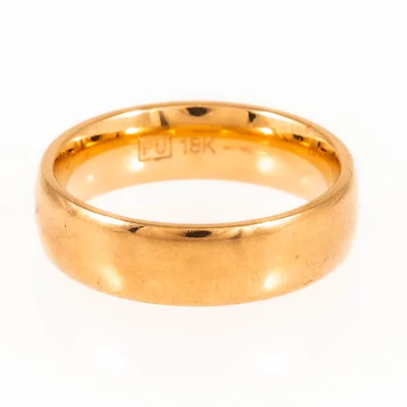 Slät ring i 18K guld. Stl:16¾. Bredd 5,4 mm. Från Flemming Uziel. Ingen gravyr. Vikt 7,1g Vikt: 7,1 g