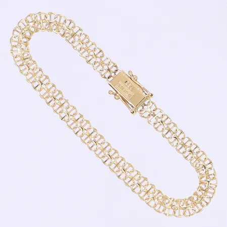 Armband X-länk med stav 17,5cm bredd 6mm tillv. Guldfynd, kistlås, bruksslitage 18K Vikt: 6,4 g