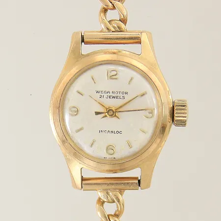 Damur Wega-Rotor 18K, automatisk, Ø20mm, boett-nr: 23700, slitet armband med säkerhetskedja 18K, lås i oädel metall, fuktskadad urtavla, inga tillbehör. Bruttovikt: 21,6g