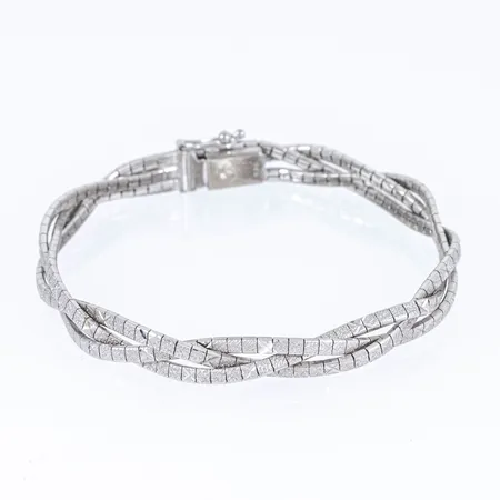 Armband flätat halvstelt längd 19cm bredd 6,5mm, silver 835/1000 17,3g.