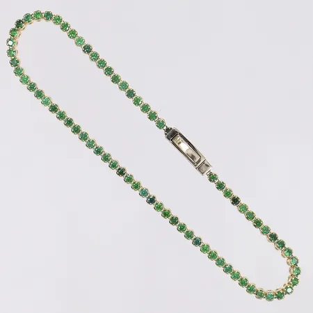 Armband med gröna stenar längd 17cm bredd 2mm 14K Bruttovikt: 2,7g Vikt: 2,7 g