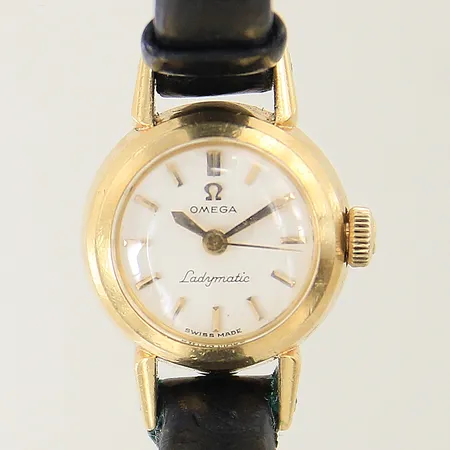 Damur Omega Ladymatic 18K automat Ø18mm plexiglas svart läderband original med slitage etui
