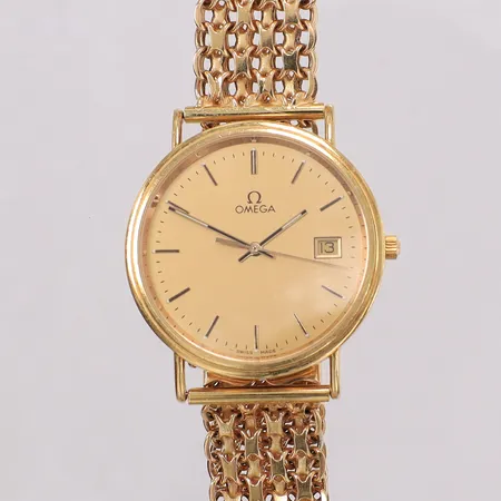 Armbandsur Omega 18K, quartz, ca 33mm, datum, armband X-länk ca 20cm inkl boett, går ej, gravyr baksida av lås. 18K bruttovikt 47,3g