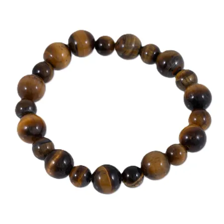 Armband av tigeröga längd ca 18cm bredd 7,5-10,5mm, uppträdd på gummivajer, 24,2g.