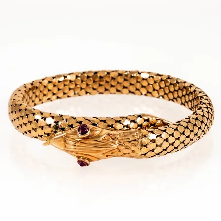 Armband halvstelt: Orm med röda stenar (syntetiska) som ögon, innermått ca 18cm bredd 8,7-13,7mm, stenar limmade, 18K 35,6g.