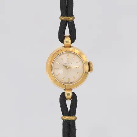 Damur Omega 18K Ø17mm manuell, tygband, lila originaletui  Vikt: 0 g