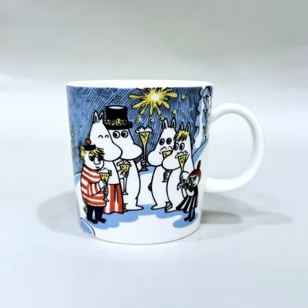 Muminmugg "Millennium 2000" formgiven av Tove Slotte-Elevant för Arabia Finland Ø8cm höjd 8cm botten med ett mindre nagg Skickas med paket.