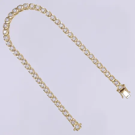 Armband riviére/tennisarmband med diamanter 48x ca 0,03ct, längd 18cm bredd 3,5mm 18K Vikt: 16,3 g