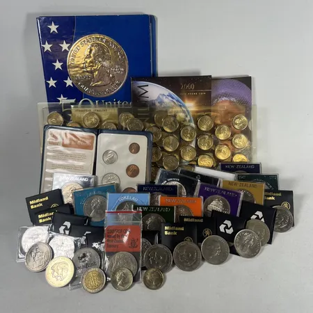 Diverse samlarmynt från Newzealand United Kingdom och USA delvis i etui varierande skick material kopparnickel