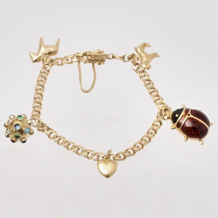 Armband 19cm, Bismarck bredd 4,4mm, 5st berlocker, 18K, 15,14g.