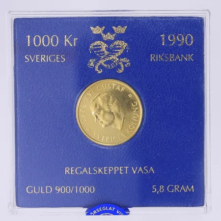 Minnesmynt Regalskeppet Vasa Ø21mm utgivet av Sveriges Riksbank 1990 nominellt värde 1000 kr i kassett 21,6K Vikt: 5,8 g