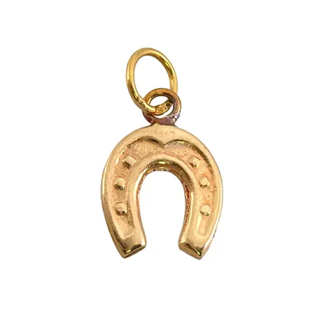 Hänge Hästsko i 18K guld, längd inkl. ögla 16 mm, bredd 9 mm Vikt: 0,4 g
