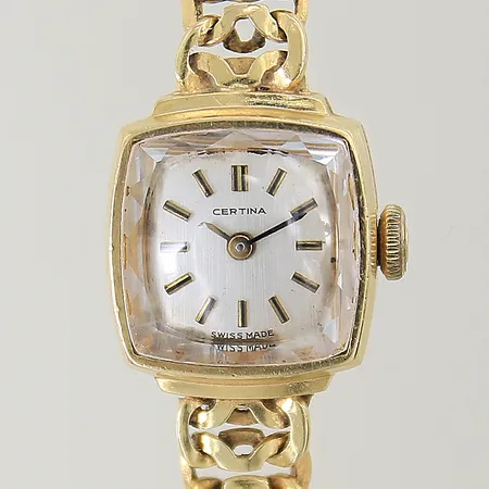 Damur Certina 18K manuell, 15x15mm, serie-nr: 248748, boett-nr: 0810879, armband 18K längd 19cm, safirglas, inga tillbehör. Brv: 24,0g 