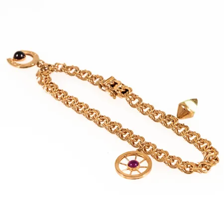 Armband Bismarck med tre berlocker längd 19cm bredd 5,5mm, 18K 15,1g.