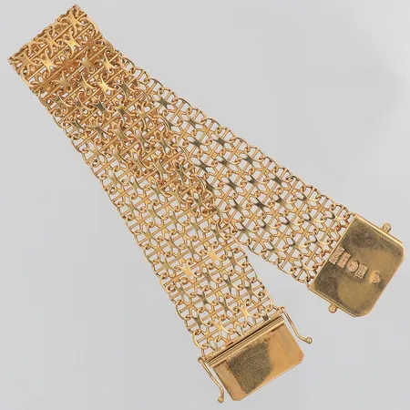 Armband X-länk Ädelsmycken år 1973 längd 18cm bredd 19mm, 18K Vikt: 25,4 g