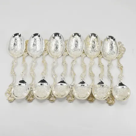 12 skedar med blomdekor, modell Oldemor, nr 356, längd 11mm, något missfärgade, silver 830/1000. Vikt: 115,7 g