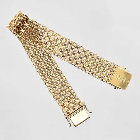 Armband X-länk längd 17cm, bredd 14mm, 18K. Vikt: 22,7 g
