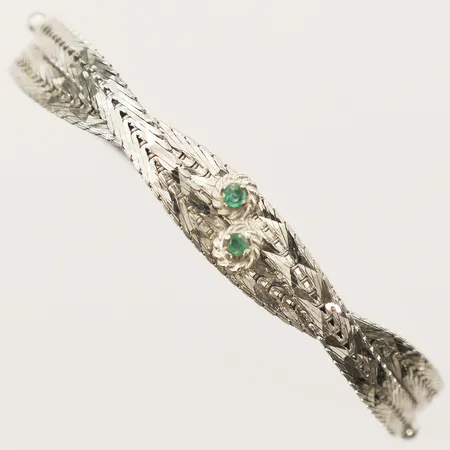 Armband halvstelt med smaragder längd 19cm, bredd 4,6-9mm slitage på stenarna vitguld 18K  Vikt: 19,7 g