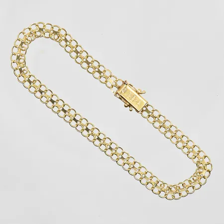 Armband X-länk längd 19cm, bredd 5mm, 18K. Vikt: 5,4 g
