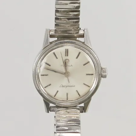 Damur Omega Ladymatic 22mm stål manuell, flexband, seg vid uppdragning, repigt originalglas.