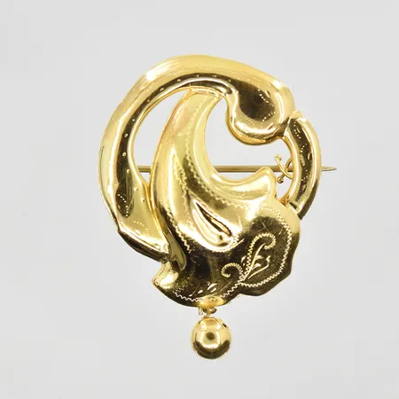 Brosch med dekor längd 40mm, bredd 30mm, pin i metall, 18K. Vikt: 4,1 g