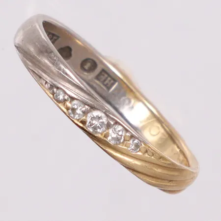 Ring tvåfärgad med diamanter 5st på totalt 0,06ct enligt gravyr, gravyr, 18K Vikt: 2,6 g