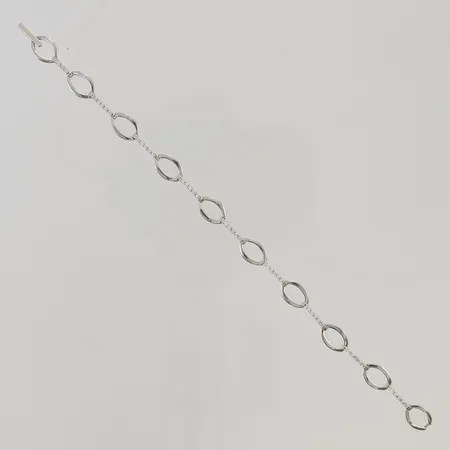 Armband 18cm bredd 7mm vita stenar 18K 6,7g.