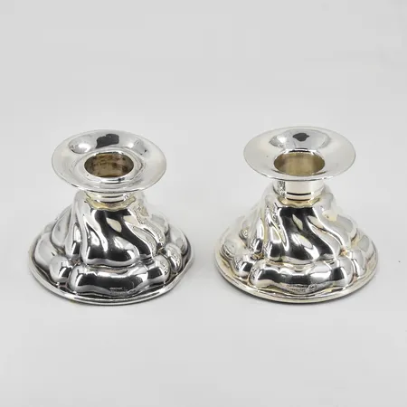 Ett par ljusstakar höjd 50mm, Ø44-67mm, fylld botten, silver 925/1000. bruttovikt 230,3g.
