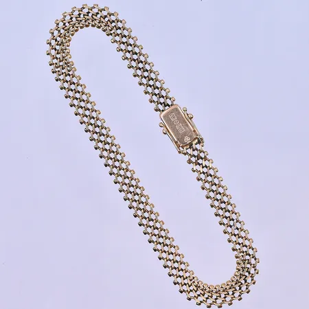 armband längd 19,5 cm, bredd 6 mm 18K. Vikt: 10,3 g