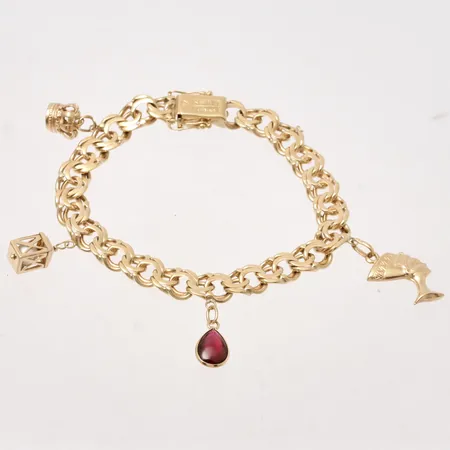Armband 20cm Bismarck bredd 8,8mm, 4st berlocker, NSE, 18K, 34,71g.