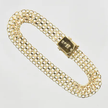 Armband X-länk längd 19½cm, bredd 10mm, 18K. Vikt: 11 g