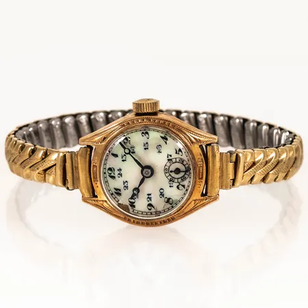 Damur Ø 21,5 mm med pärlemorurtavla (skador) 14K. Gravyr. Manuellt urverk. Flexiband doublé.