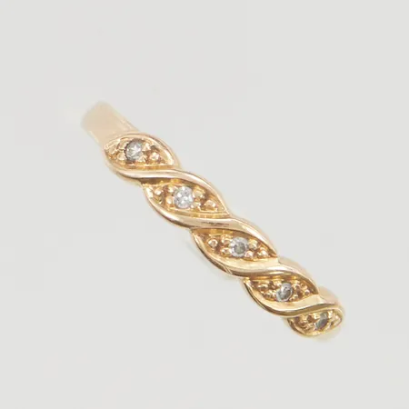 Ring med diamanter 5x ca 0,01ct stl:16¾ bredd 3mm 18K 1,7g.