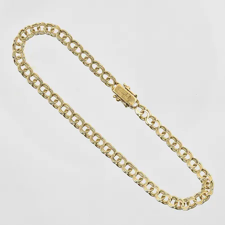 Armband Bismarck längd 20cm, bredd 4mm, låser dåligt, 18K. Vikt: 6,6 g