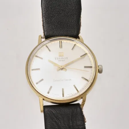 Herrur Tissot Seastar Seven i 18K guld, manuell, Ø33,5mm, gravyr på boett " För nit och redighet i rikets tjänst", läderband.