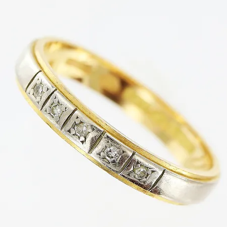 Ring stl:18½ diamanter 0,05ctv enligt gravyr, bredd: 3,5mm, slitage, vit/gulguld, gravyr, 18K.  Vikt: 3,6 g