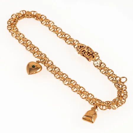 Armband X-länk med två berlocker längd 20cm bredd 5,5mm, ögla utan berlock, 18K 9,4g.
