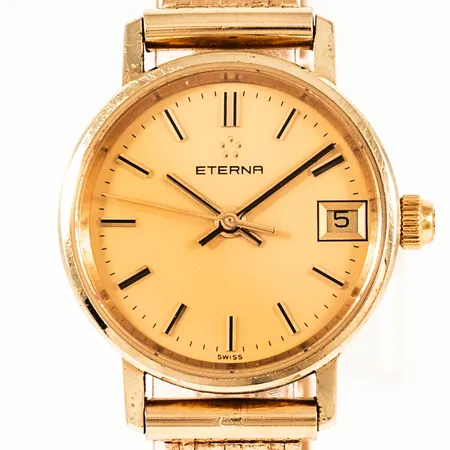 Damur Eterna guld 14K quartz 22mm datum, safirglas, urband Korridor i 14K total längd inkl ur 17cm, bredd 8,7mm. Går ej - Batteribyte krävs? Gravyr. Bruttovikt:23,7g. 