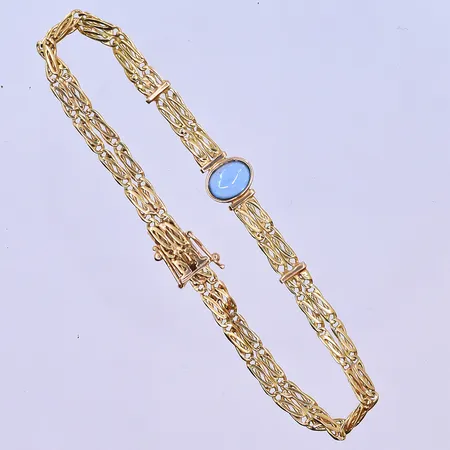 Armband med blå sten längd 19,5 cm, bredd 5 mm 18K. Vikt: 9,7 g