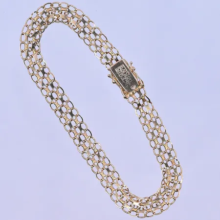 Armband X-länk längd 19 cm, bredd 7 mm 18K. Vikt: 7,4 g