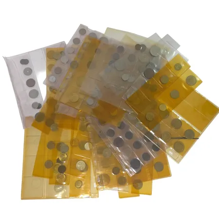 Stort parti utrikiska mynt, ej fullständigt genomgånget, från tidigt 1900-tal och framåt, bruttovikt med plastfickor omkring 1950 gram Skickas med paket.