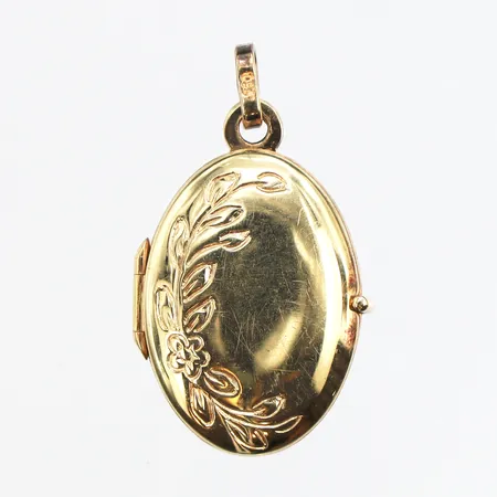 Medaljong, längd ca 22mm, bredd ca 13mm, 18K. Vikt: 1,4 g