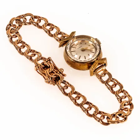 Smyckeur Tissot guld 14K manuell Ø17mm, safirglas, urband Bismarck i guld 14K total längd 16cm bredd 6mm, bruttovikt: 14,7g.