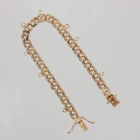 Armband Bismarck 17,5cm, bredd 6mm, uppklippta öglor, 18K Vikt: 13,3 g