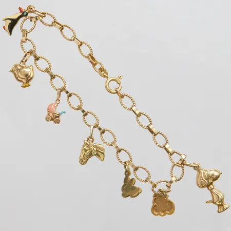 Armband med sju berlocker längd ca 19,5cm, bredd ca 5,5-30mm, slitage, 14K  Vikt: 10 g