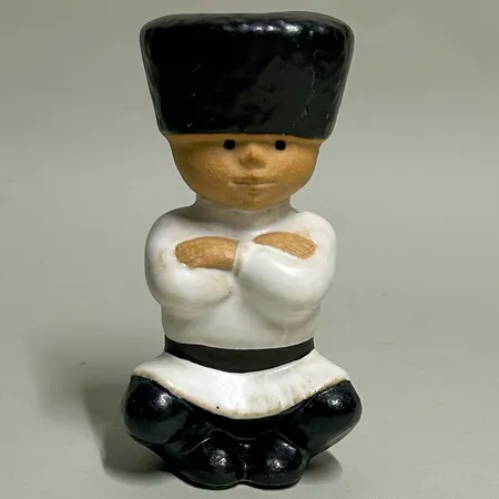 Figurin "Ivan" Lisa Larson för Rörstrand ur serien All Världens Barn, höjd 12cm, stämplar, delvis glaserat stengods