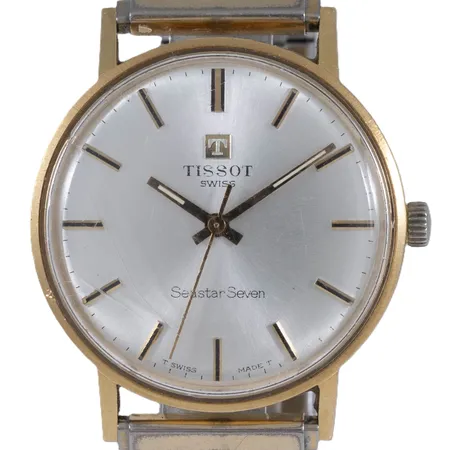 Herrur Tissot Seastar Seven guld 18K manuell Ø33,5mm plexiglas, flexband i metall längd 18cm bredd 15,5mm, repigt glas, namn- och datumgravyr. Bruttovikt: 58,1g.