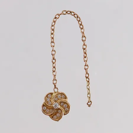 Del av smycke med diamanter 1 x ca 0,02ct 15 x ca 0,0075ct 18K. Vikt: 1,4 g