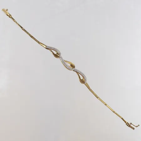 Armband med vita stenar längd 16cm bredd 1,5-8mm 18K. Vikt: 6,4 g
